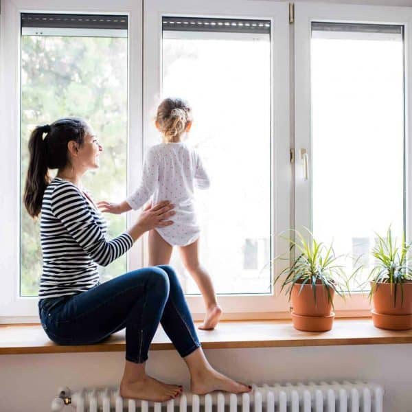 women and child looking out a new window