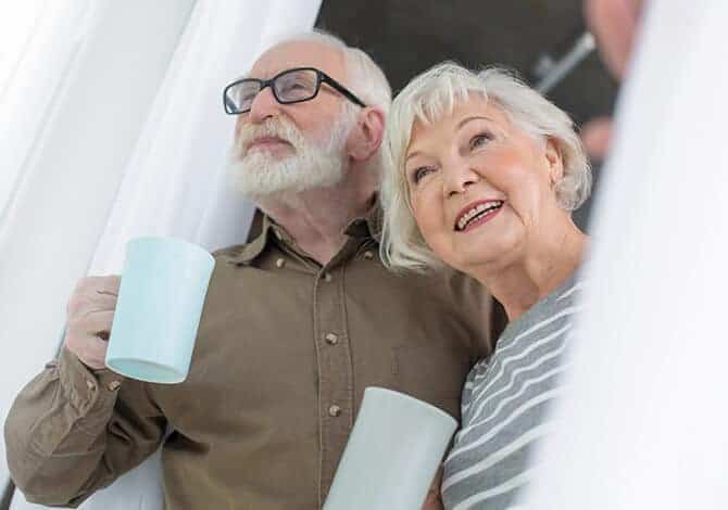 older couple opening their new windows