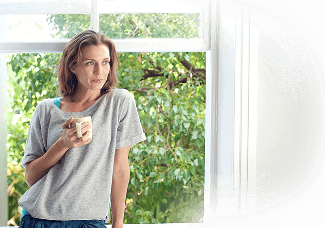 women standing in front of a newly installed windows smiling